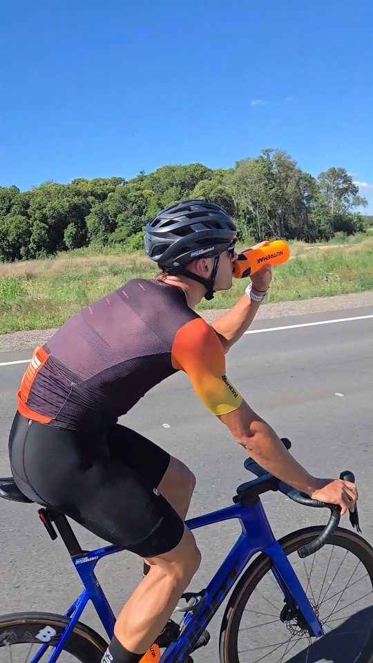 Nutremax ad. Angle: A sponsored rider fuels long road races with 80 g of carbs a dose